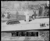 Title:Good Luck, Kaye Don.Hampton - New racing boat all set!Sir J. Thornycroft hands over “Miss England III” to Lord Wakefield and famous speed-king.n00:00:12t20:00:12Thornycroft (SOF) standing in front of speedboat on canal in rain, gives presentation speech.Wakefield responds saying he hopes to regain the world’s water speed record.n00:00:57t20:00:57LS across Lake Garda (?), outboard boats racing while mechanics work on outboard, Sunkist Kid II, at dock below.Racing driver