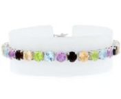 https://www.ross-simons.com/834311.htmlnnAll the colors of the rainbow come together in one vivacious bracelet. This tennis design lines up 18.60 ct. tot. gem. wt. of amethyst, garnet, citrine, peridot, and blue topaz rounds. Box clasp, sterling silver bracelet.