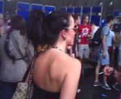 THIS IS A CLIP OF A VERY SEXY DARK HAIRED BRUNETTE LADY STANDING SEXY IN A FULL LEATHER DRESS.