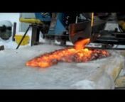 Syracuse University Lava ProjectnnInterested? A free online course starts April 7th http://syracuseu.coursesites.com/nnOn January 22, 2011, the fifth lava pour took place using the #700 gas fired tilt furnace operated by the SU Sculpture Program. This 610lb pour was the most successful to date in terms of material consistency, volume, duration of pour, viscosity, duration of flow, structure of flow, etc. The lava was poured on to a 6” thick block of ice measuring 3.5’ by 10’. This pour was