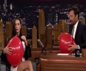 Demi Moore shows Jimmy photos and video of her without one of her false teeth in and explains her edgy comedy Rough Night while sucking out helium of a balloon.