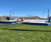 This guy was attempting pole vault when things didn&#39;t go his way. He ran with the pole and planted it, but did not jump. He bent back with the pole, springing him away onto the ground.
