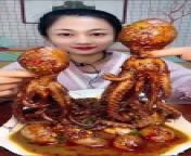 Cute Asian Eating Cooked Octopus from 12inc cook