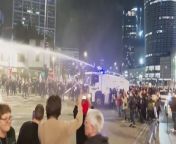 Police fire water cannon to disperse anti-government protesters in Tel AvivAP
