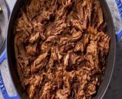 Our shredded beef recipe is made up of beef chuck seasoned with chili powder and cumin then seared and braised in a beef broth until fork-tender.