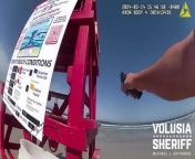 Moment boy pulls gun out on packed Spring Break Florida beach before fleeing into oceanSource Volusia Sheriff&#39;s Office