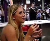 Sexy Blonde Beauty eating a sausage pretending it&#39;s oral sex.