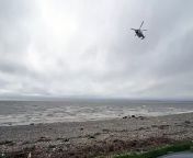 Coastguard helicopter searching Morecambe Bay