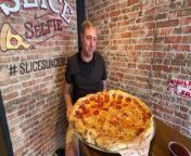 Sunderland Echo reporter Neil Fatkin takes on the challenge of eating a 24-inch pizza at Slice Sunderland